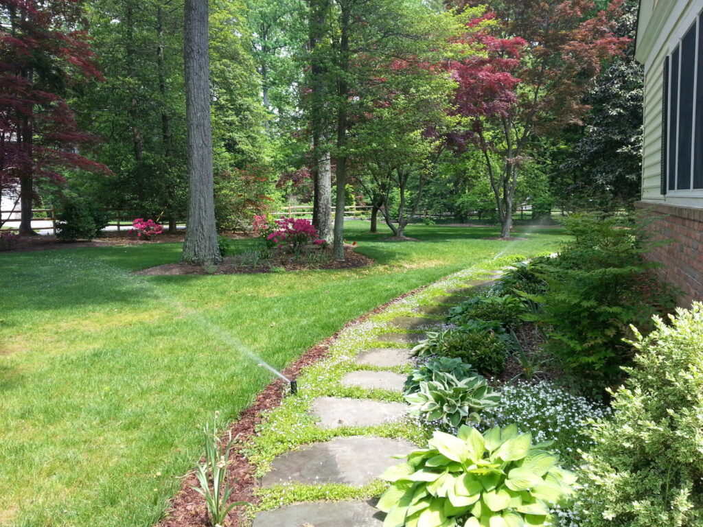 sprinkler lawn garden path trees